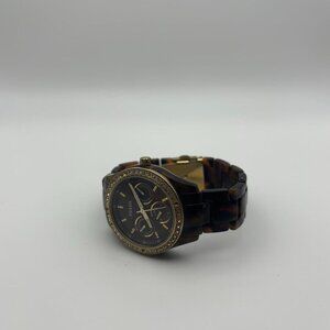 Vintage women’s Fossil watch with brown tortoise band!